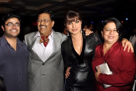 Chopra with her parents and brother in 2012