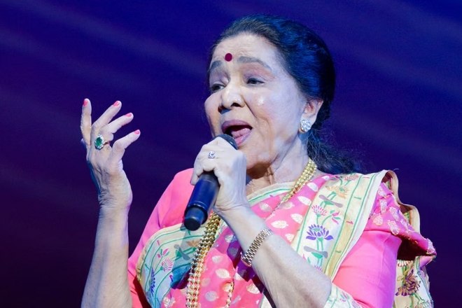 An archive performance portrait in a pink sari.