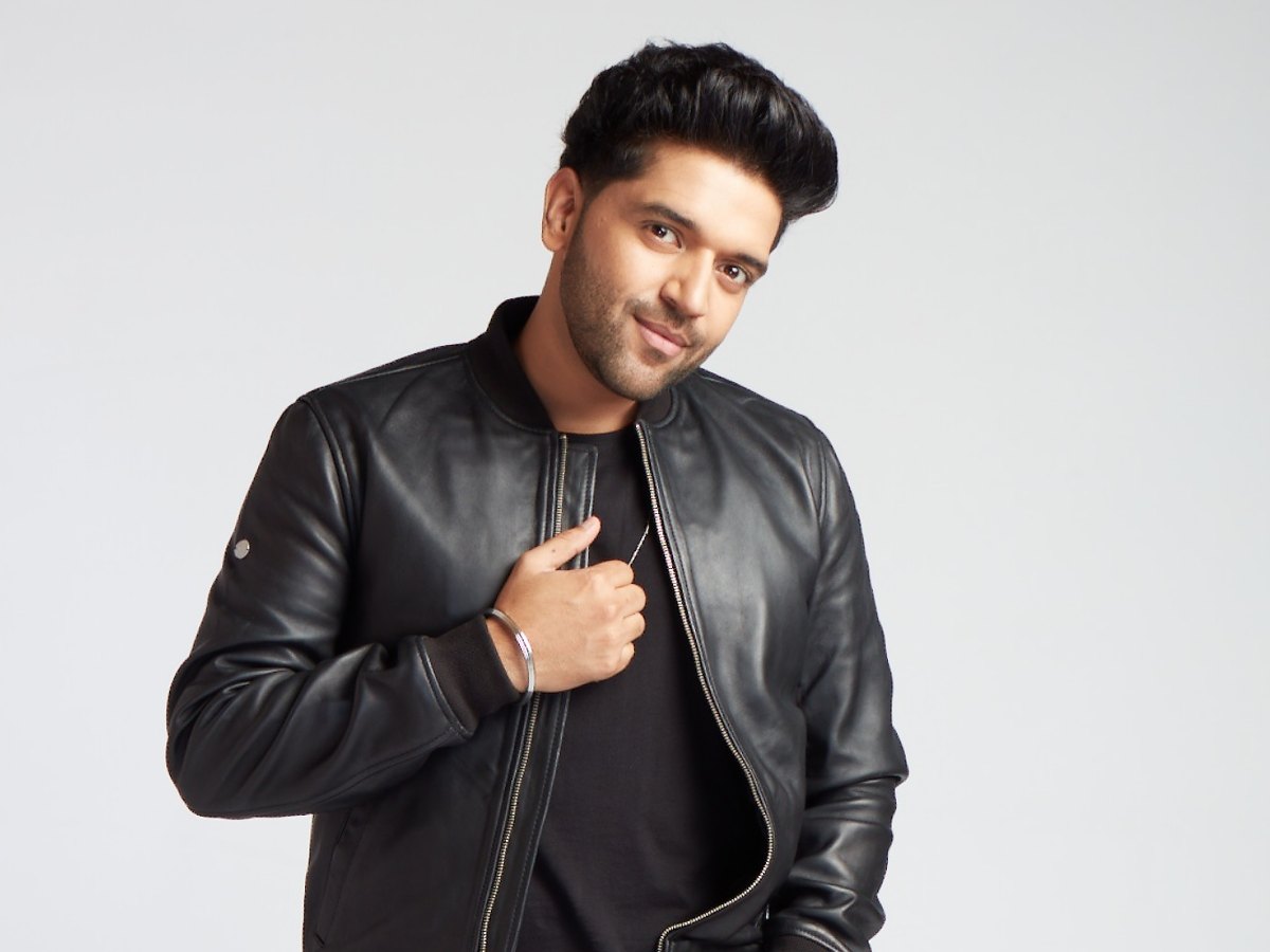 A promotional portrait in a leather jacket.