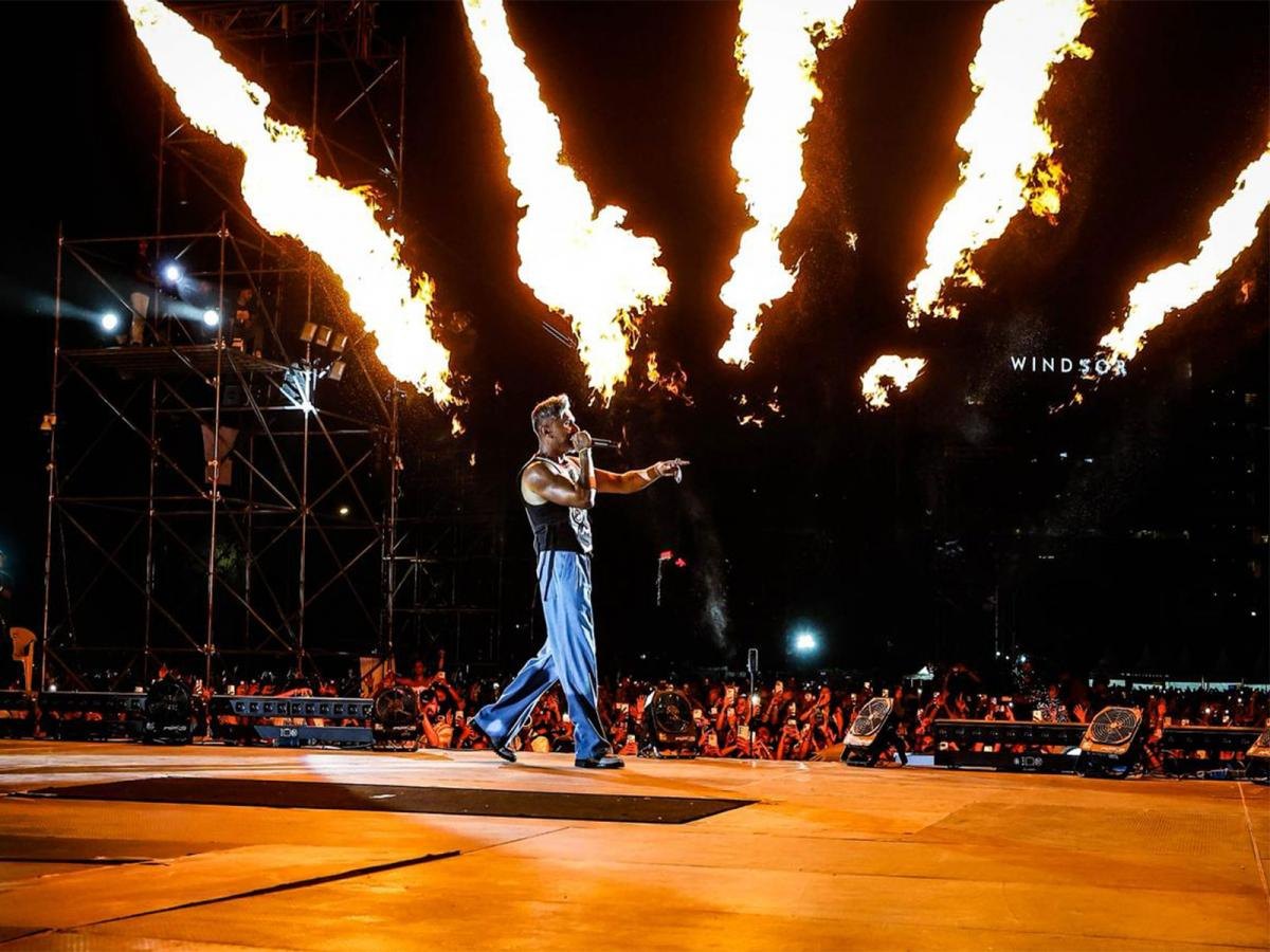 A wide concert view with dramatic stage effects.